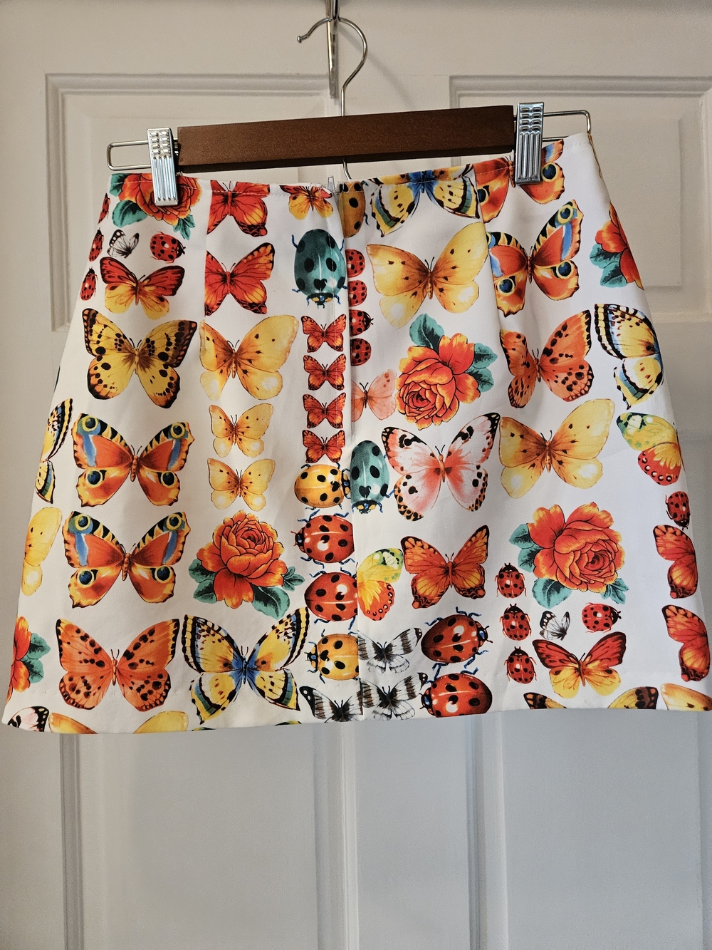 White Mini Skirt with Multicolor Butterfly & Ladybug Print - Picture 2 of 3